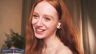 lizzy_blaze - A young woman with red hair dances a striptease