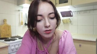 emilyquen -Charming housewife dancing in a dress in the kitchen