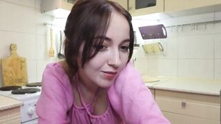 emilyquen -Charming housewife dancing in a dress in the kitchen