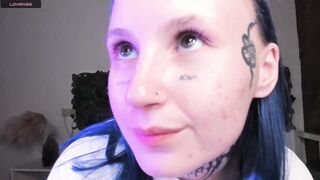 bennymurrh_ -A young woman in tattoos is sitting around chatting.