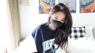 amyalwayshere -An Asian woman wearing a mask hides her face